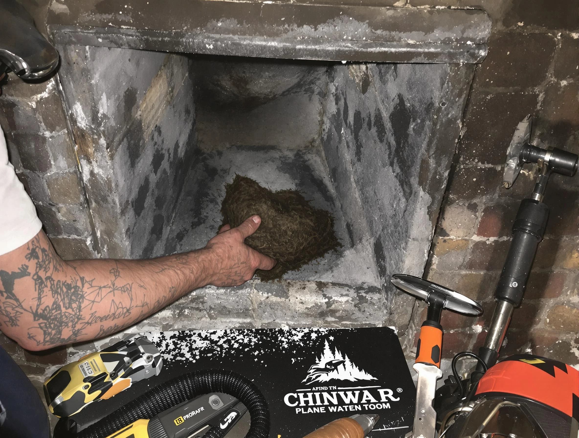 Cranberry Chimney Sweep safely removing debris and screening chimney in Cranberry, PA